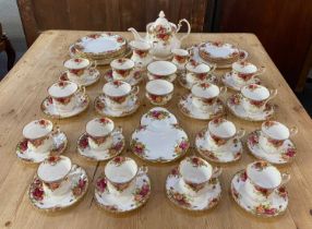 A Royal Albert Old Country Roses porcelain part tea and dinner service comprising teapot 22cm,