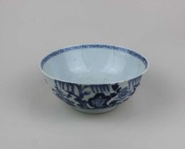 A Chinese blue and white porcelain bowl with floral decoration, (a/f hairline cracks), 18cm