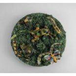 A Portuguese Jose A Cunha Caldas Rainha pottery majolica 'Palissy' style wall plate decorated with a