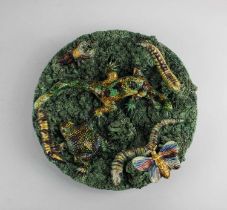 A Portuguese Jose A Cunha Caldas Rainha pottery majolica 'Palissy' style wall plate decorated with a
