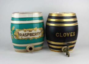 A ceramic barrel labelled CLOVES, with tap, 28cm high, and another labelled RASPBERRY (tap