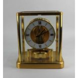 A Jaeger Le Coultre Atmos mantle clock glazed gilt metal framed case 21cm