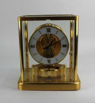 A Jaeger Le Coultre Atmos mantle clock glazed gilt metal framed case 21cm