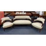 A Victorian upholstered settee and two matching tub chairs with upholstered back rails and seats