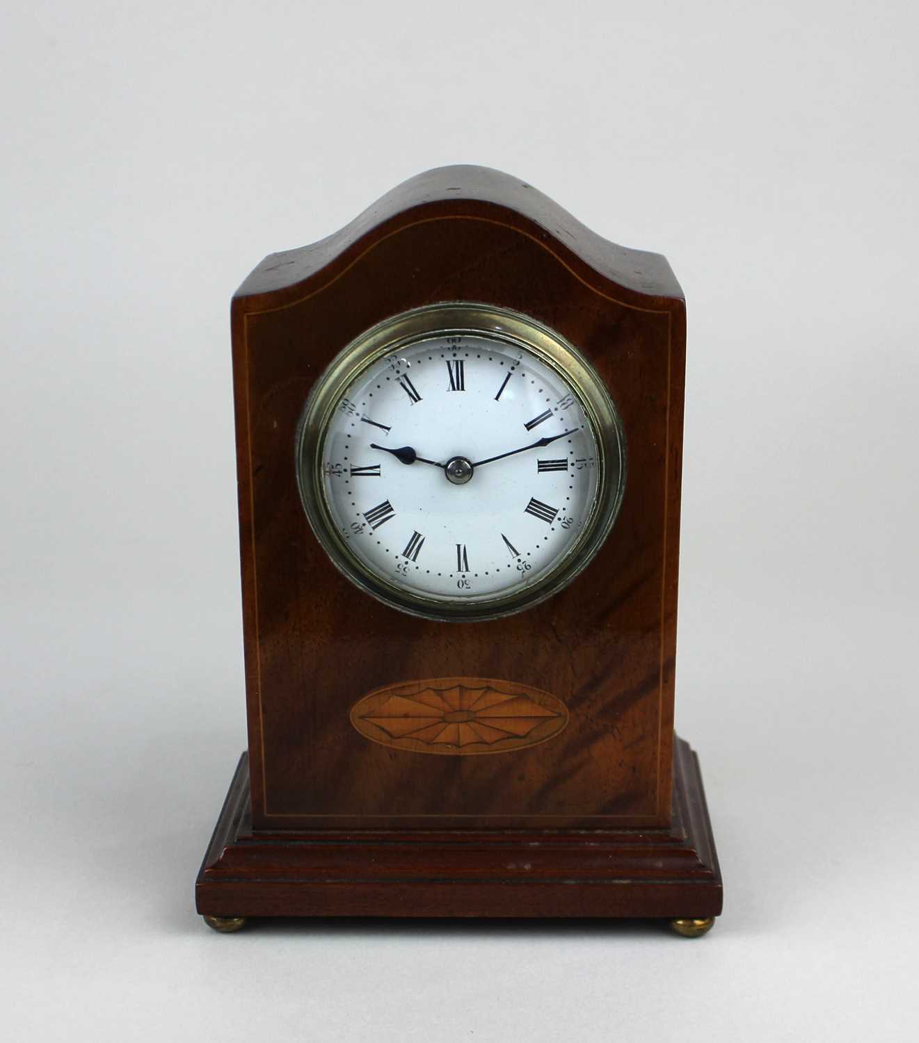 A small Edwardian mahogany mantle clock the circular enamel dial with Roman numerals 16.5cm high