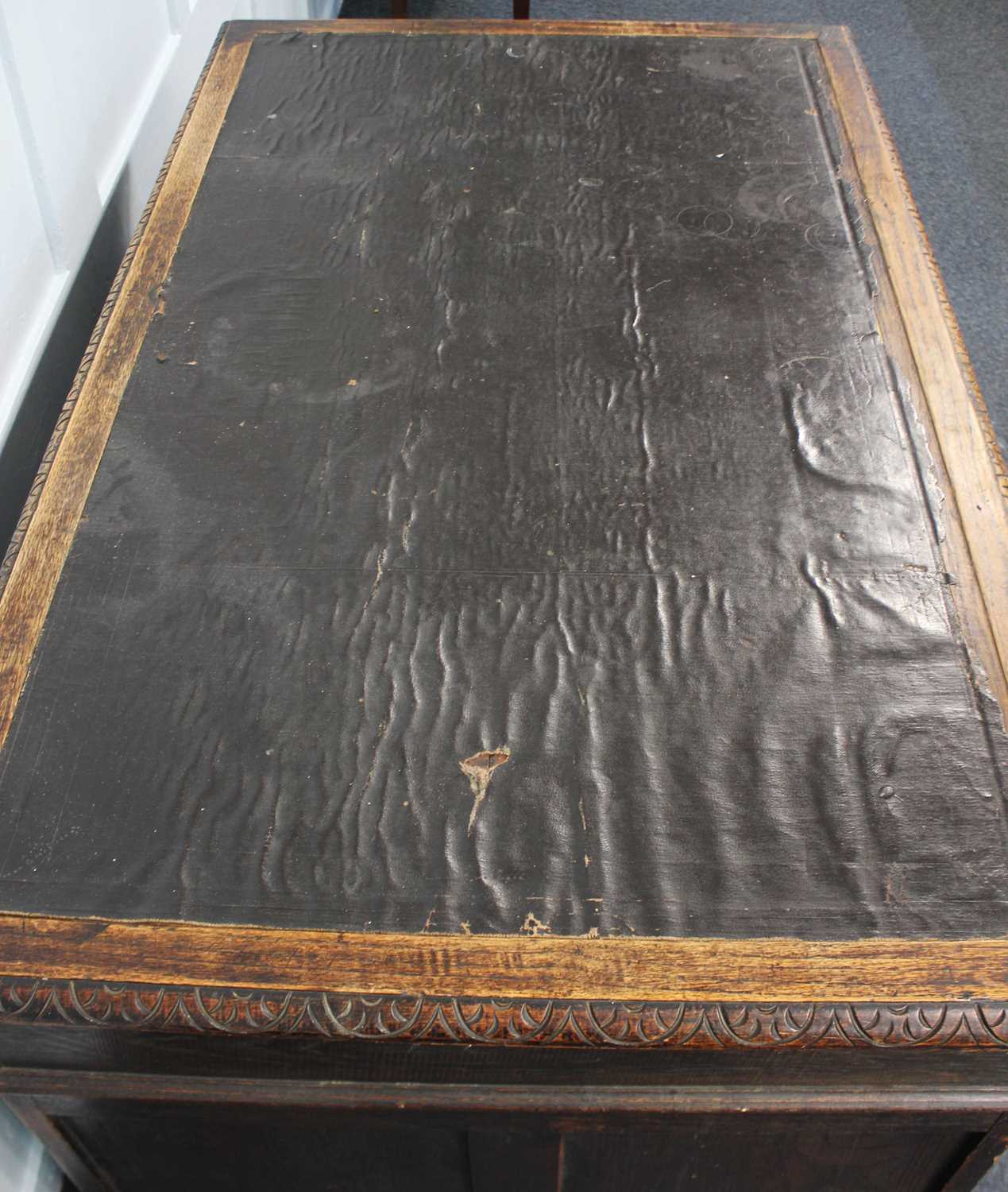 A Flemish style carved oak pedestal desk the rectangular leather inset top above an arrangement of - Image 2 of 2