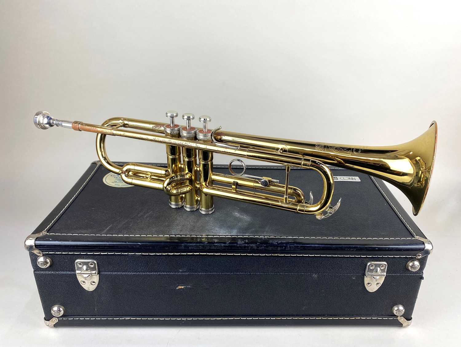 A Conn USA trumpet with mouthpiece in fitted case (a/f)