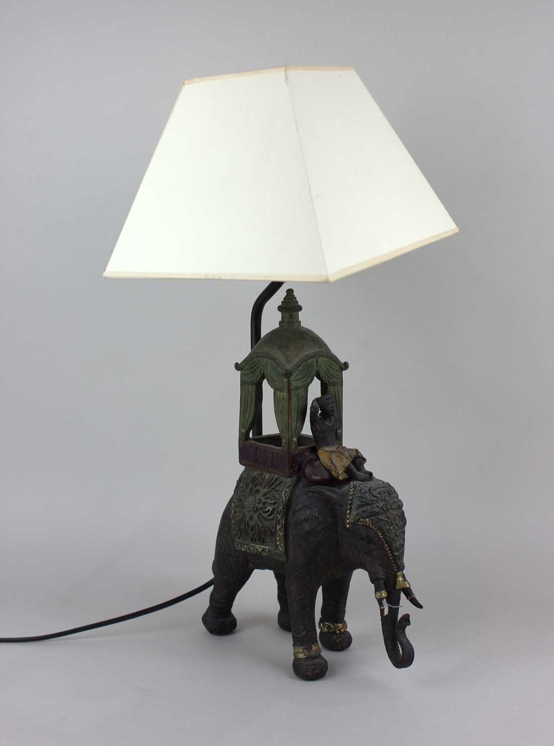 A 20th century table lamp in the form of an elephant with seated figure and howdah approx 30cm