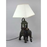 A 20th century table lamp in the form of an elephant with seated figure and howdah approx 30cm