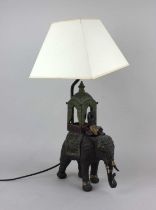 A 20th century table lamp in the form of an elephant with seated figure and howdah approx 30cm