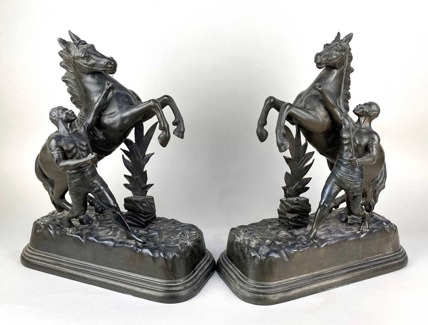 A pair of metal models of Marley horses 41cm high (a/f)