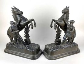 A pair of metal models of Marley horses 41cm high (a/f)