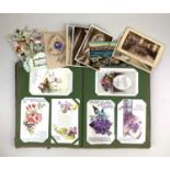 A collection of early 20th century and later postcards and greetings cards to include an album, most