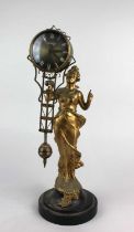 An Art Nouveau style figurine clock with gilt spelter figure of Diana holding aloft swinging