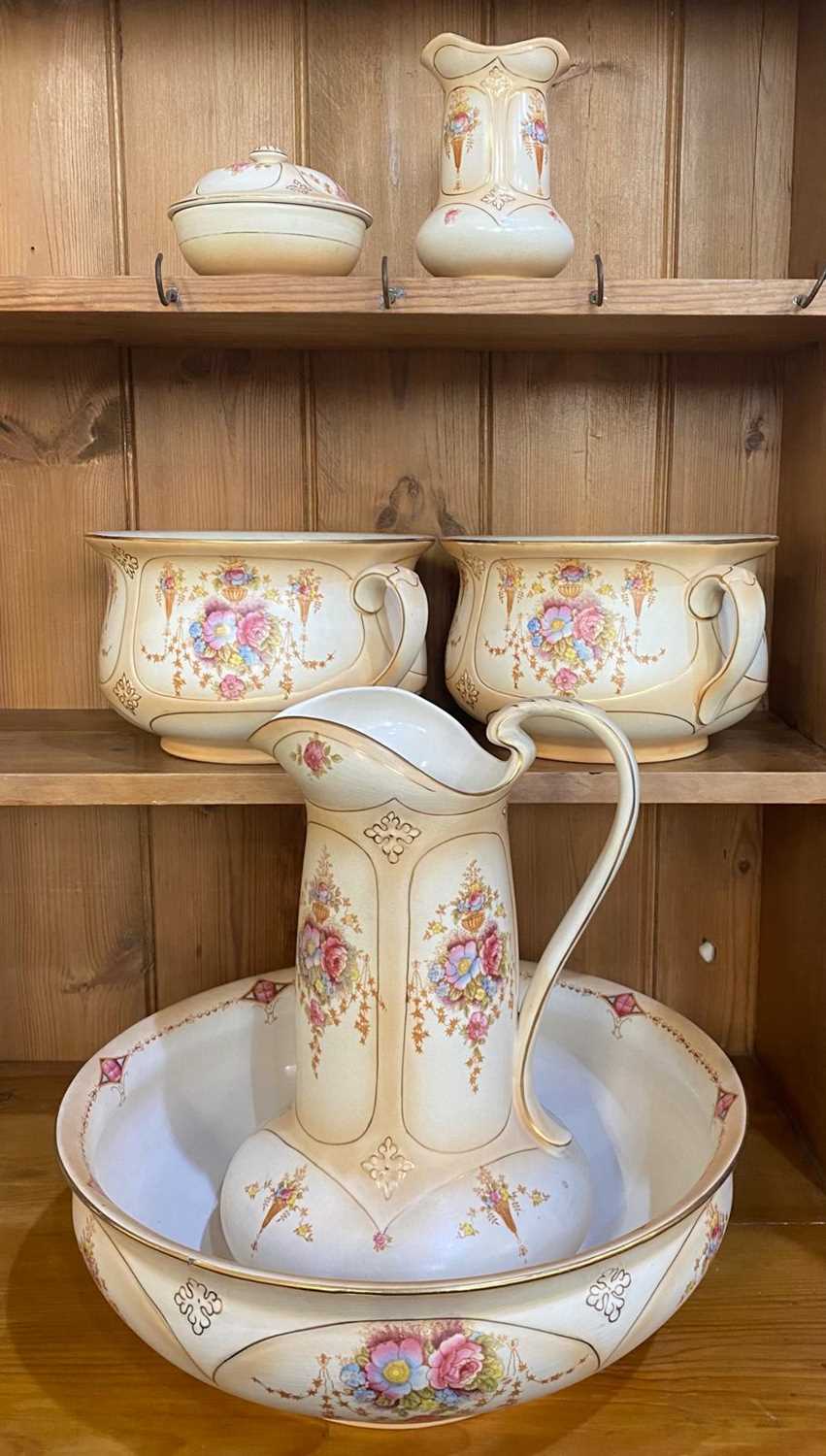 A late 19th / early 20th century Art Nouveau Fieldings Devon Ware six piece toilet set in the '