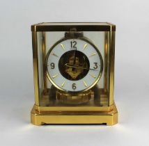 A Le Coultre Atmos mantle clock glazed gilt metal framed case with 'flip down' front panel, c.1970'