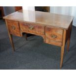 A 19th century mahogany kneehole dressing table the rectangular top above an arrangement of three