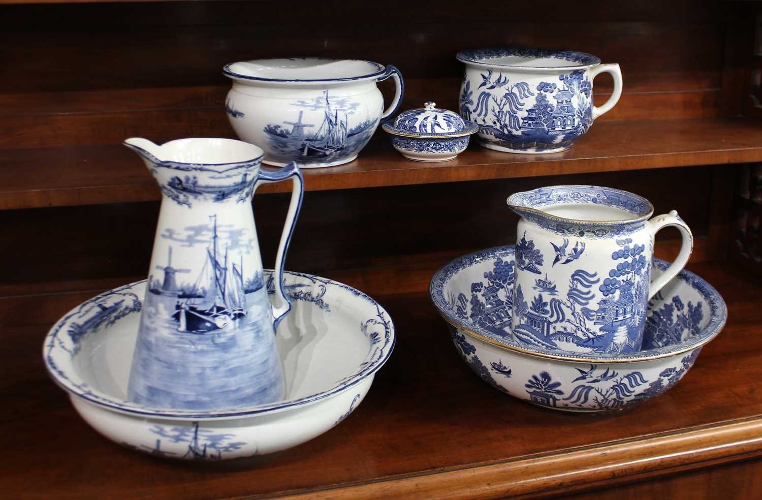 A Winkle & Co 'Delph' pattern blue and white ceramic toilet set, c.1900/1910, comprising a tall jug,