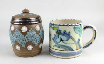 A silver mounted Doulton Lambeth Silicon ware tobacco jar and a Collard Honiton pottery mug