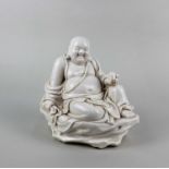 A 20th century Chinese porcelain figure of the Maitreya Buddha, with incised character marks and