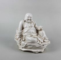 A 20th century Chinese porcelain figure of the Maitreya Buddha, with incised character marks and