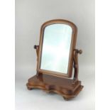 A Victorian mahogany framed dressing table mirror on shaped platform base 48cm high