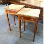 A pair of mahogany bedside tables with square tops and single drawer with drop ring handles, on