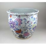 A Chinese ceramic fish bowl with floral decoration on white ground 35cm high