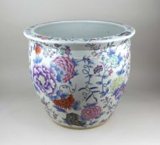 A Chinese ceramic fish bowl with floral decoration on white ground 35cm high