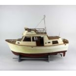 A model cruiser boat the Neptune on stand, (a/f radio control mechanism untested) 70cm