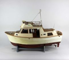 A model cruiser boat the Neptune on stand, (a/f radio control mechanism untested) 70cm