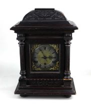 A late 19th century German mantle clock with chiming movement by Kienzle in carved wooden case