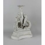 A Parian ware candlestick decorated with winged grotesques 34cm high (a/f)