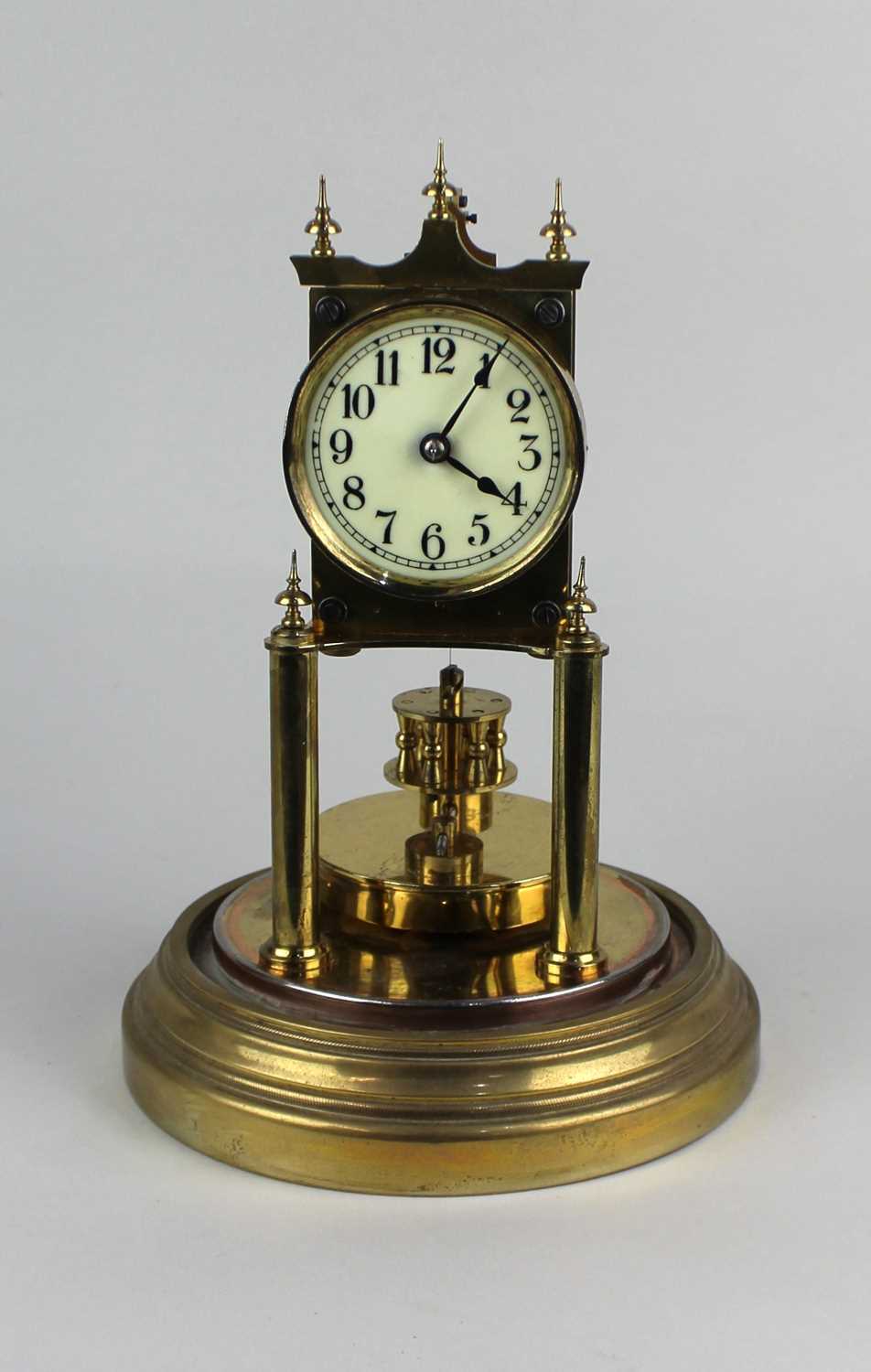 A gilt metal anniversary mantle clock under a glass dome on circular base, 29cm - Image 2 of 6