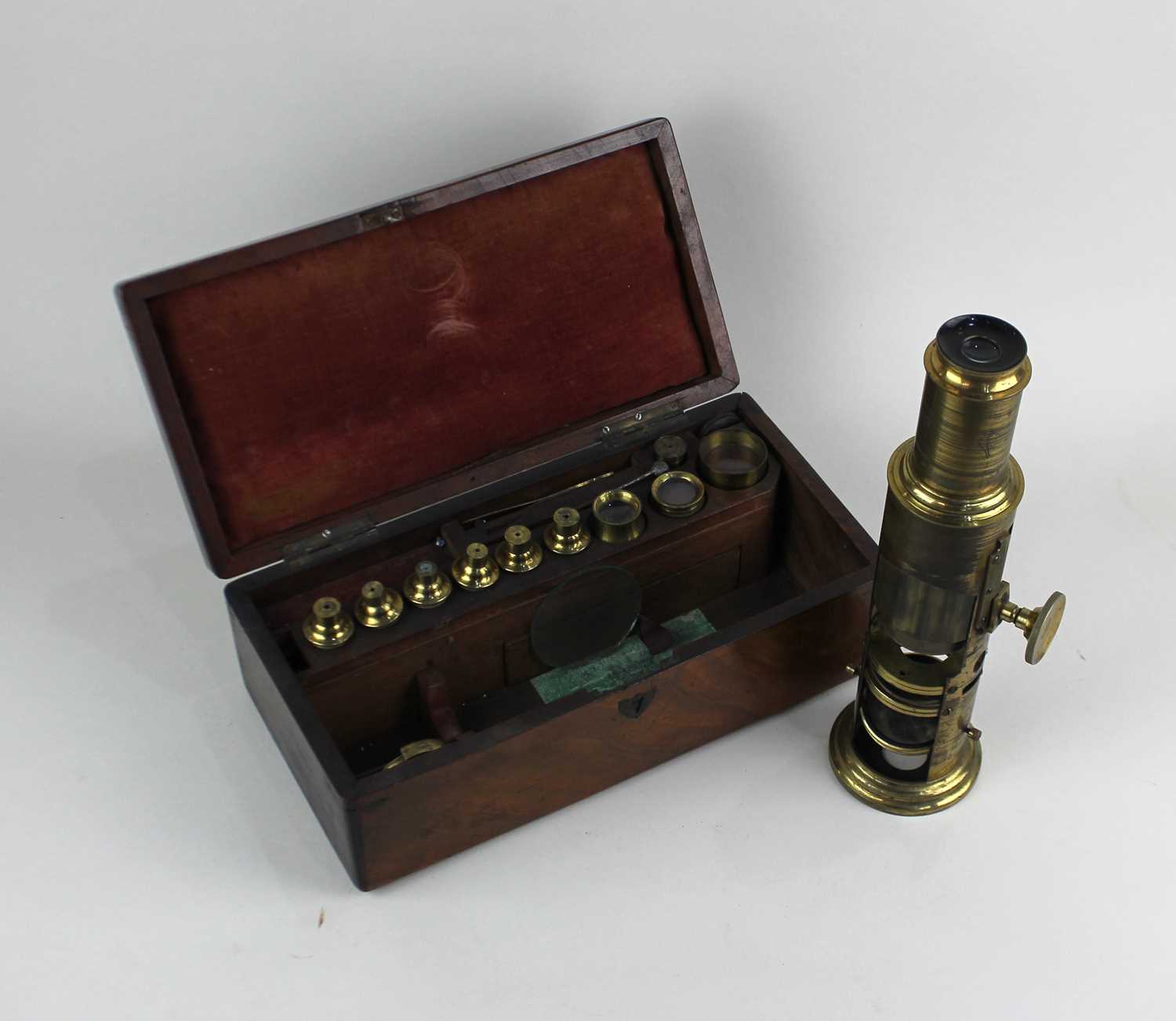 A brass monocular 'drum' microscope engraved 'Newton & Co, Opticians, 3 Fleet Street, Temple Bar,