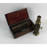 A brass monocular 'drum' microscope engraved 'Newton & Co, Opticians, 3 Fleet Street, Temple Bar,