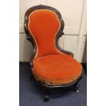 A Victorian carved walnut show-wood lady's chair, upholstered back and seat, raised on ceramic