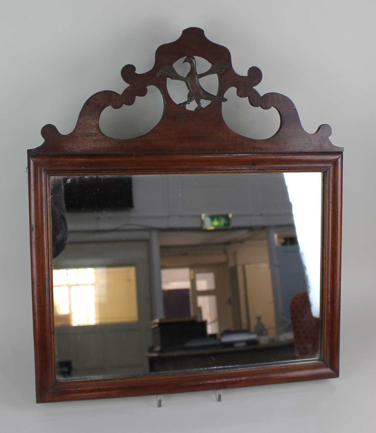 A George III style mahogany fret cut wall mirror with pierced bird surmount mirror plate 29.5cm by
