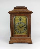 An early 20th century Gustav Becker oak bracket clock with silvered chapter ring. gilt scroll dial