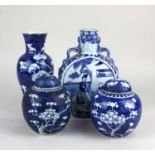 A 19th century Chinese blue and white ceramic moonflask, with twin dragon handles, painted with