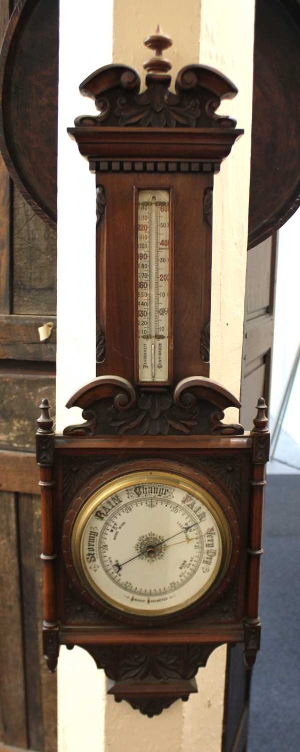 A 20th century carved aneroid barometer thermometer, 98cm high