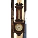 A 20th century carved aneroid barometer thermometer, 98cm high