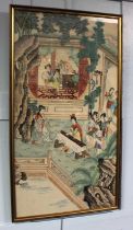 A framed Chinese painting on rice paper of figures engaged in various pursuits in a garden setting