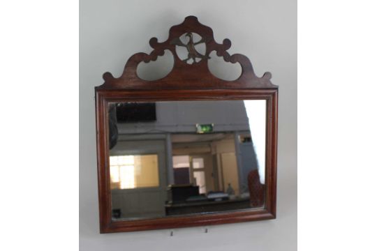 A George III style mahogany fret cut wall mirror with pierced bird surmount mirror plate 29.5cm by