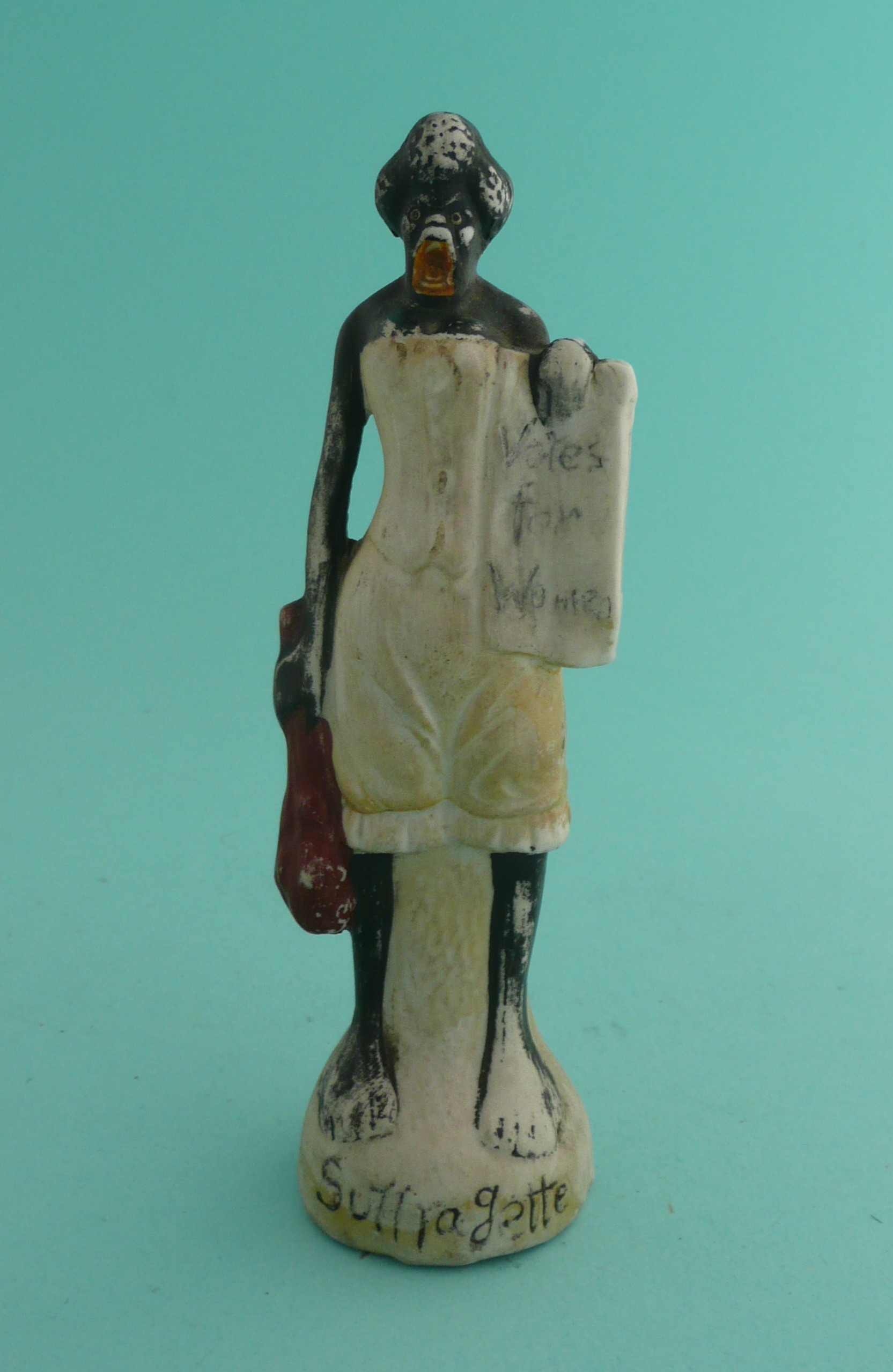 Sojourner Truth: a bisque porcelain figure depicted standing holding a placard inscribed ‘Votes