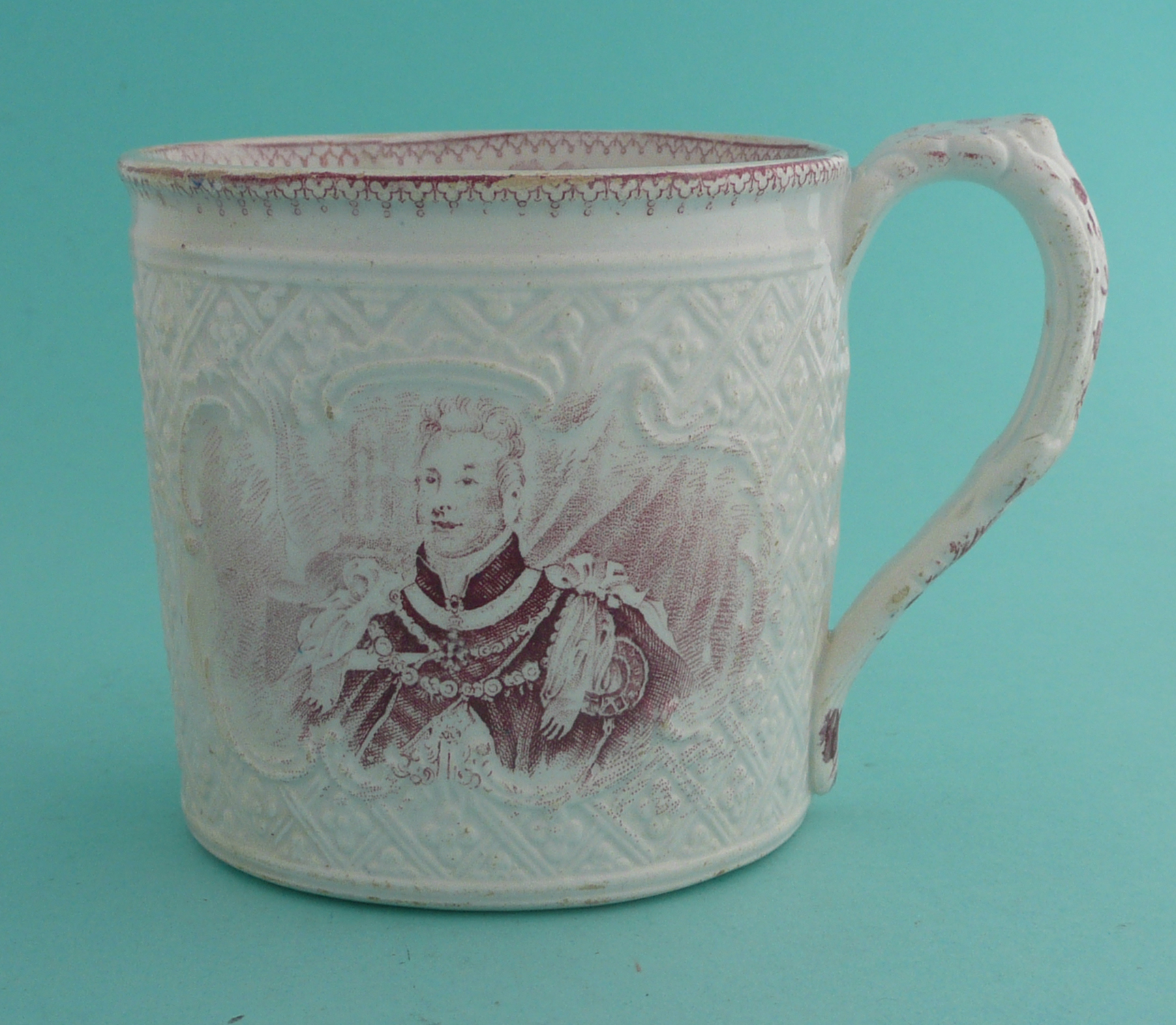 1831 Coronation: a mug moulded with a lozenge design printed in pink with portraits, 85mm. (