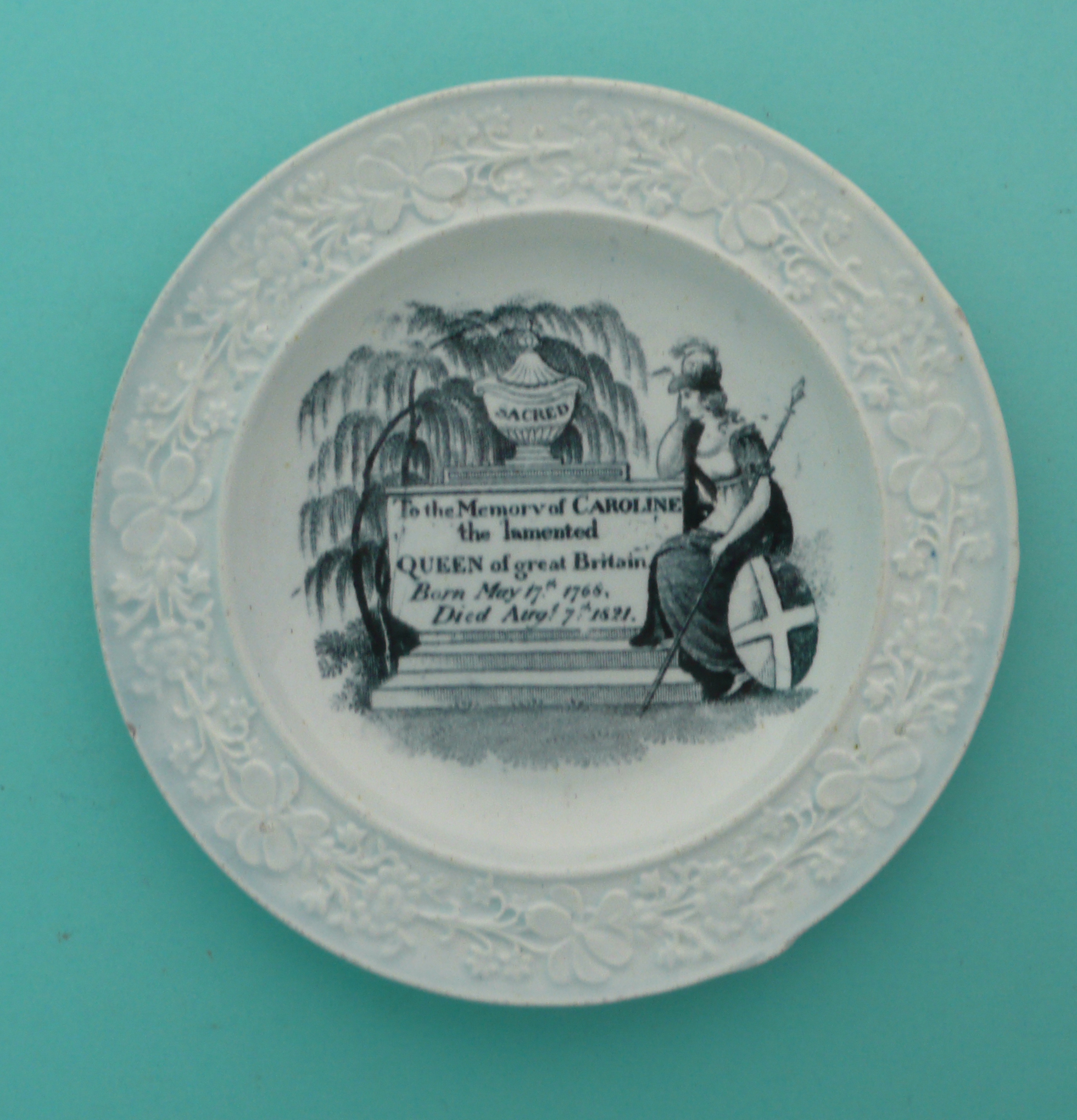 1821 Caroline in Memoriam: a pearlware nursery plate printed in black with Britannia grieving at