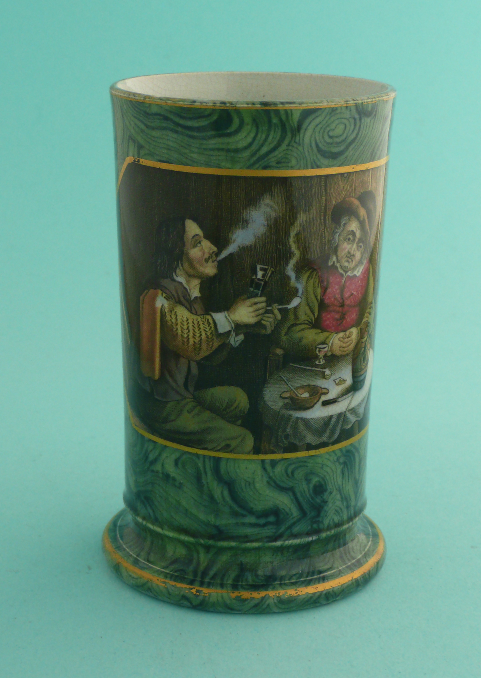 A malachite ground spill vase: The Smokers (251) 107mm, tiny glaze chip to inner rim. (potlid, pot