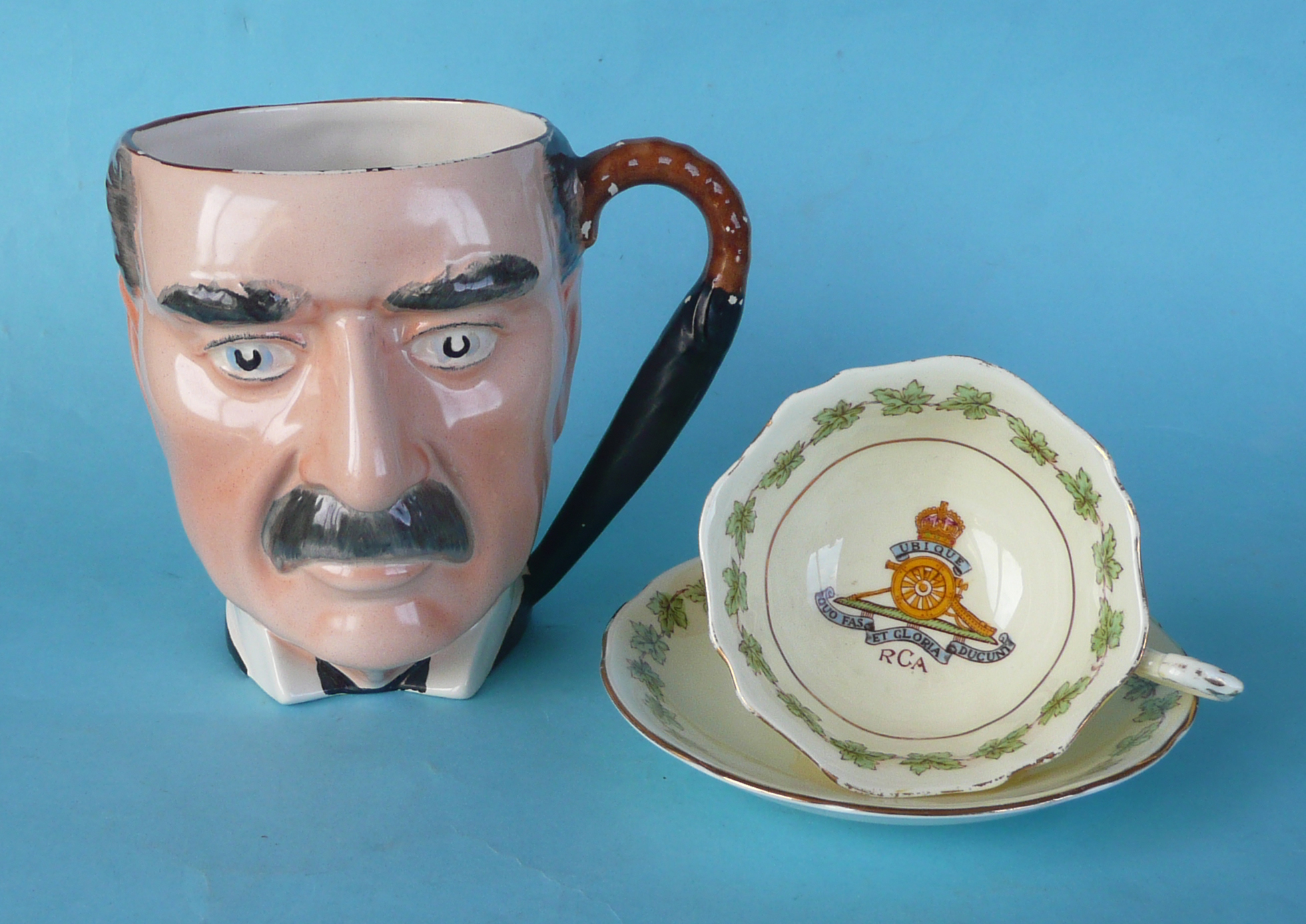 A character jug by Gibsons depicting Neville Chamberlain, the underside dated 1939, 138mm, paint