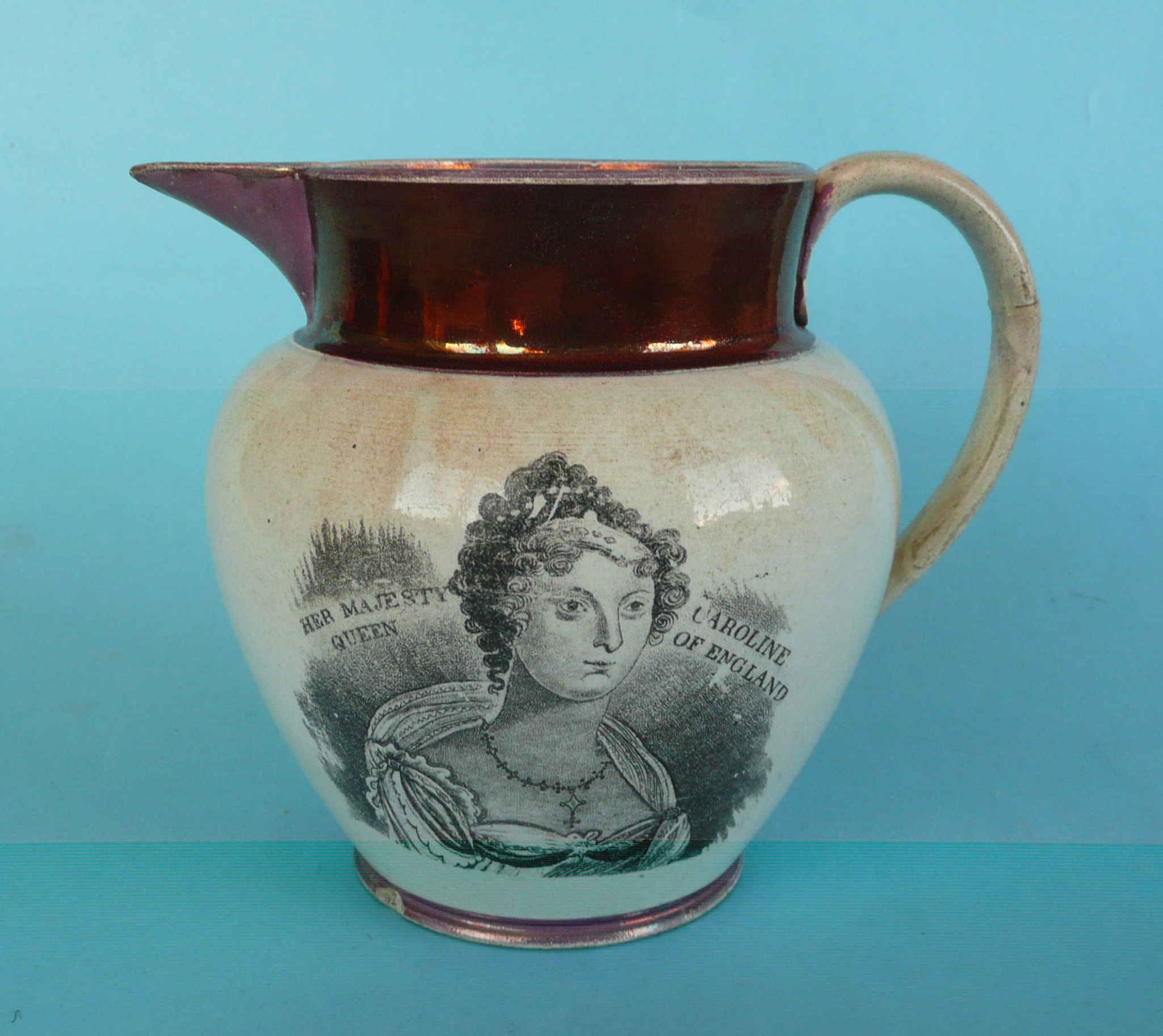 Queen Caroline: an unusual copper and pink lustre banded jug printed with a named portrait and on